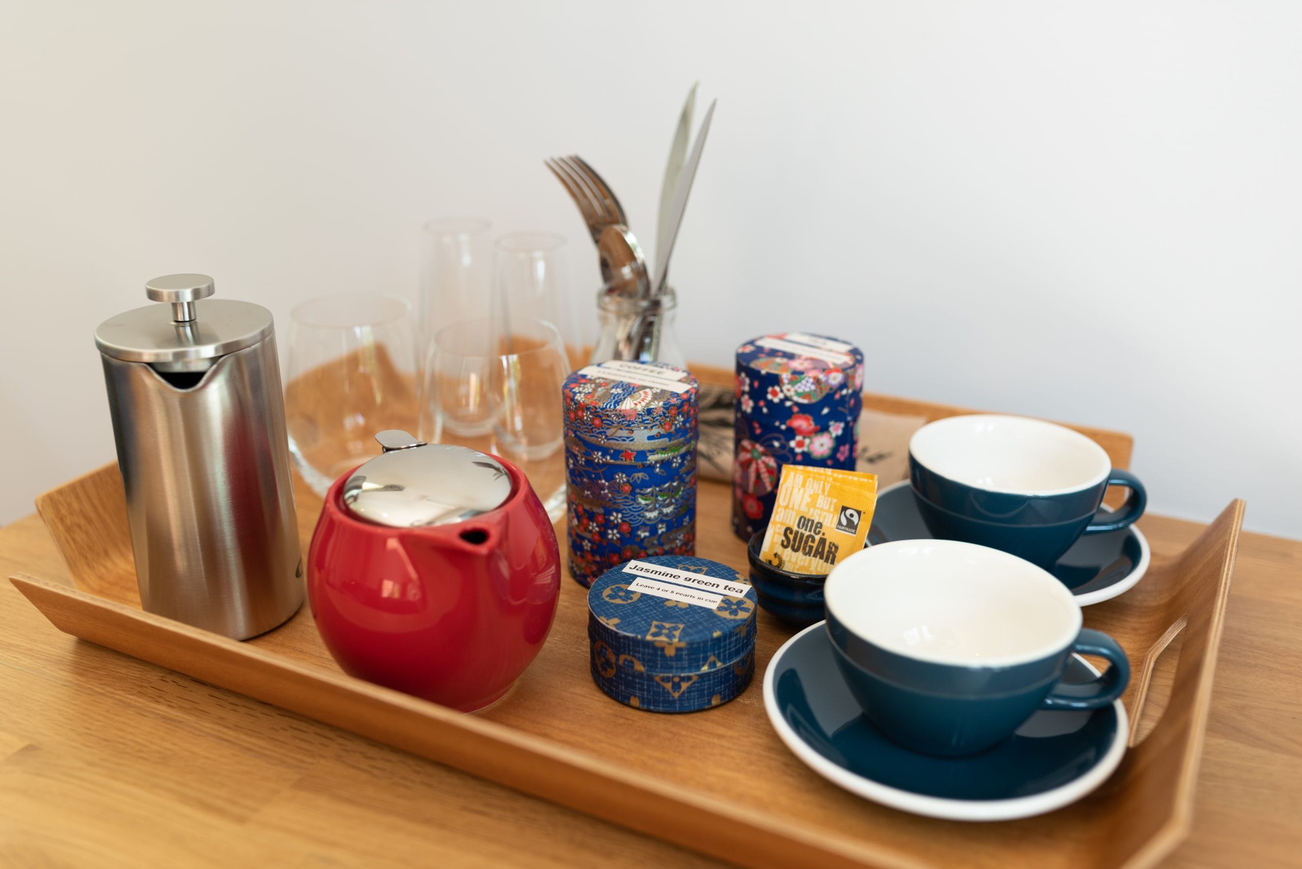 In-room specialty teas and locally roasted plunger coffee in the Takahē suite at Pāteke Lodge.